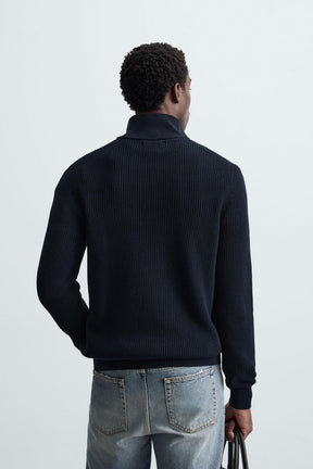 LINKSGESTRICKTER PULLOVER MIT REISSVERSCHLUSS