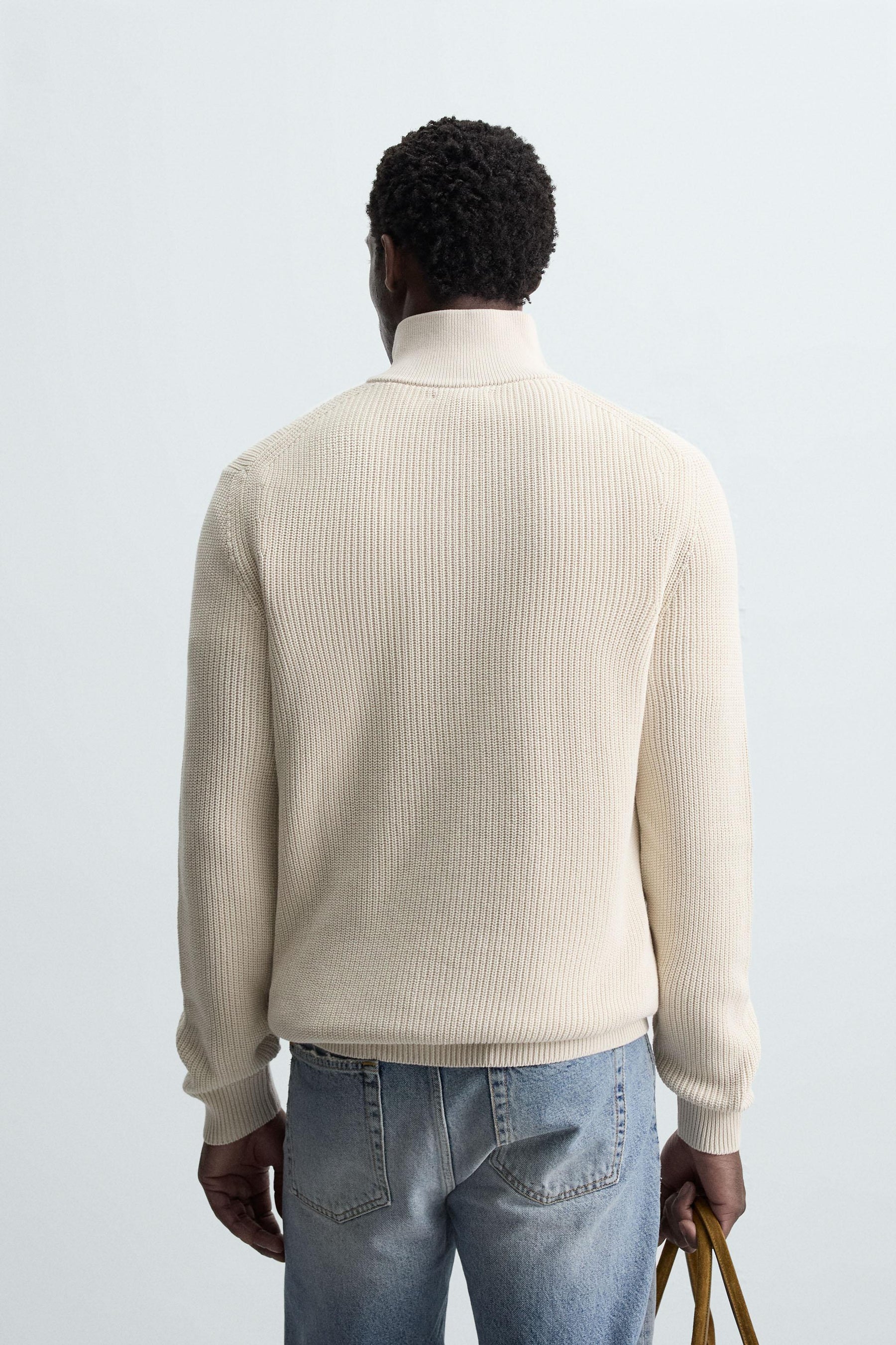 LINKSGESTRICKTER PULLOVER MIT REISSVERSCHLUSS