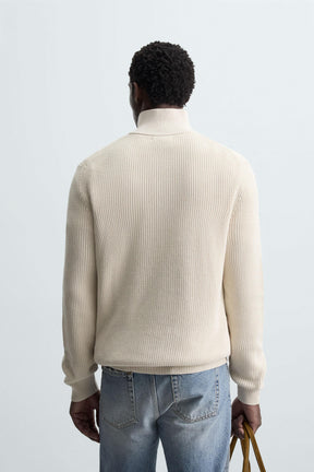 LINKSGESTRICKTER PULLOVER MIT REISSVERSCHLUSS