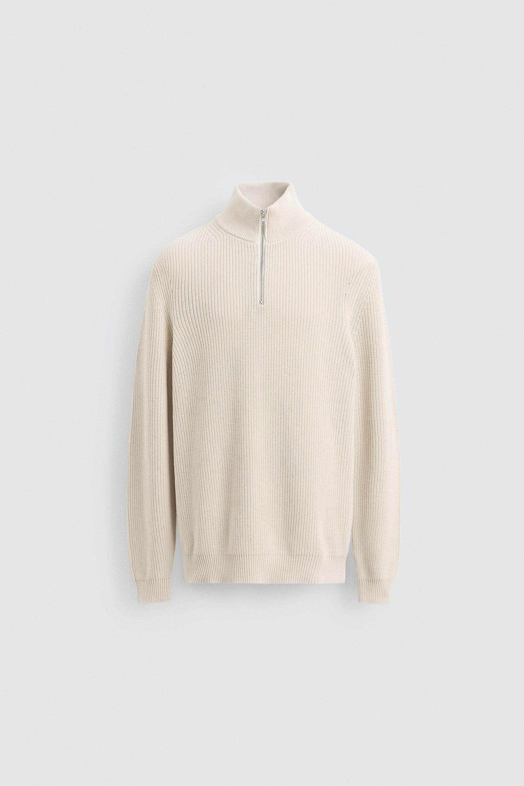 LINKSGESTRICKTER PULLOVER MIT REISSVERSCHLUSS