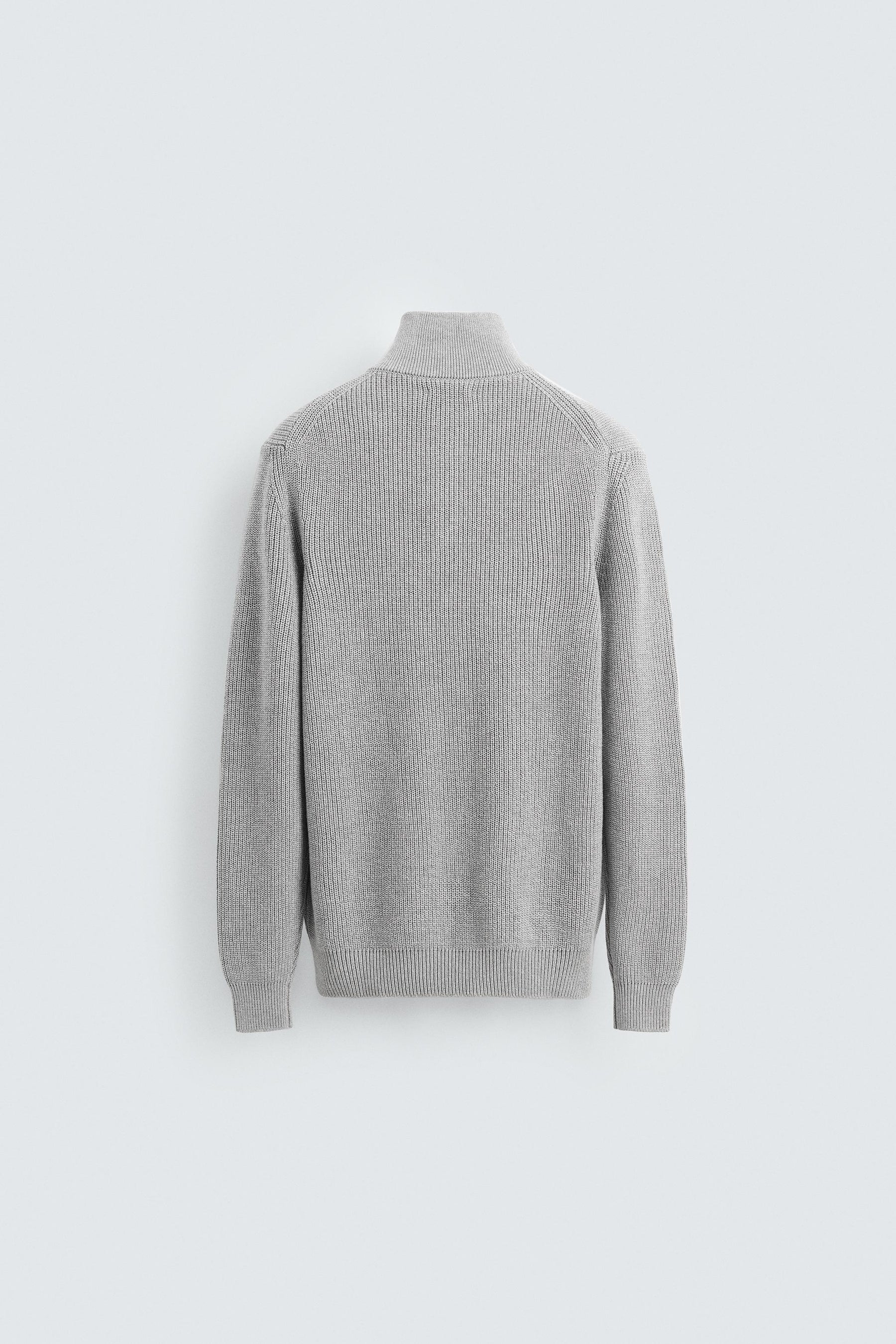 LINKSGESTRICKTER PULLOVER MIT REISSVERSCHLUSS